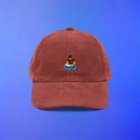 Red corduroy cap with Home Teleport OSRS embroidery on the front, Old School RuneScape merch cap and a fun gift for gamers