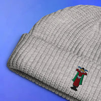 Crying emote embroidered beanie laid flat with OSRS inspired design, Old School RuneScape merch beanie and a funny gift