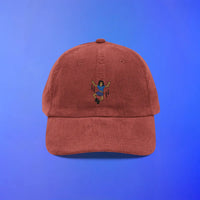 Red corduroy cap featuring OSRS inspired emote embroidery, Old School RuneScape merch cap and a bold gift idea