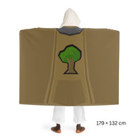 Back view of a Woodcutting skillcape hooded sherpa fleece blanket, inspired by Old School RuneScape, a cozy OSRS merch piece and a unique gift for gamers
