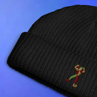 Jester embroidered beanie laid flat with OSRS themed design, Old School RuneScape merch beanie and a playful gift