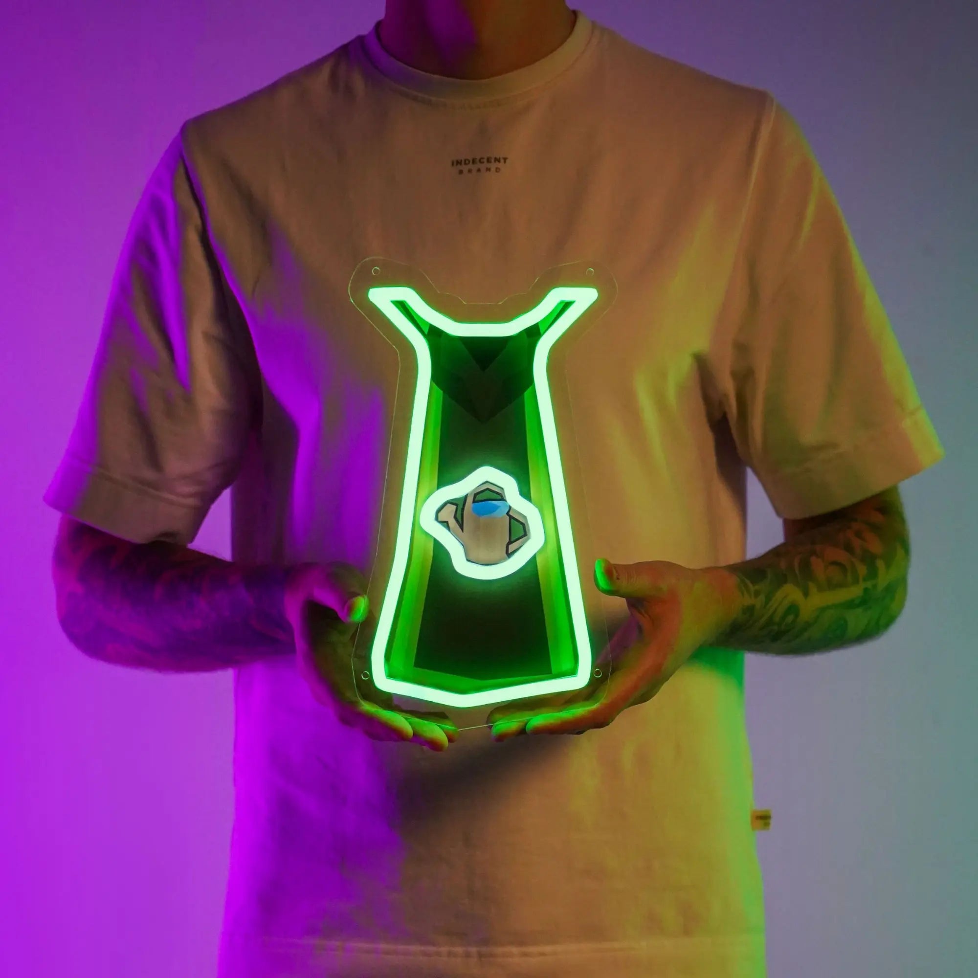 A person proudly holds up the Runescape Farming Skillcape LED neon sign, showcasing the iconic farming skill symbol from the game. This LED neon sign celebrates the art of farming in RuneScape, making it a perfect addition to any gaming space. A nostalgic gift for Runescape enthusiasts.