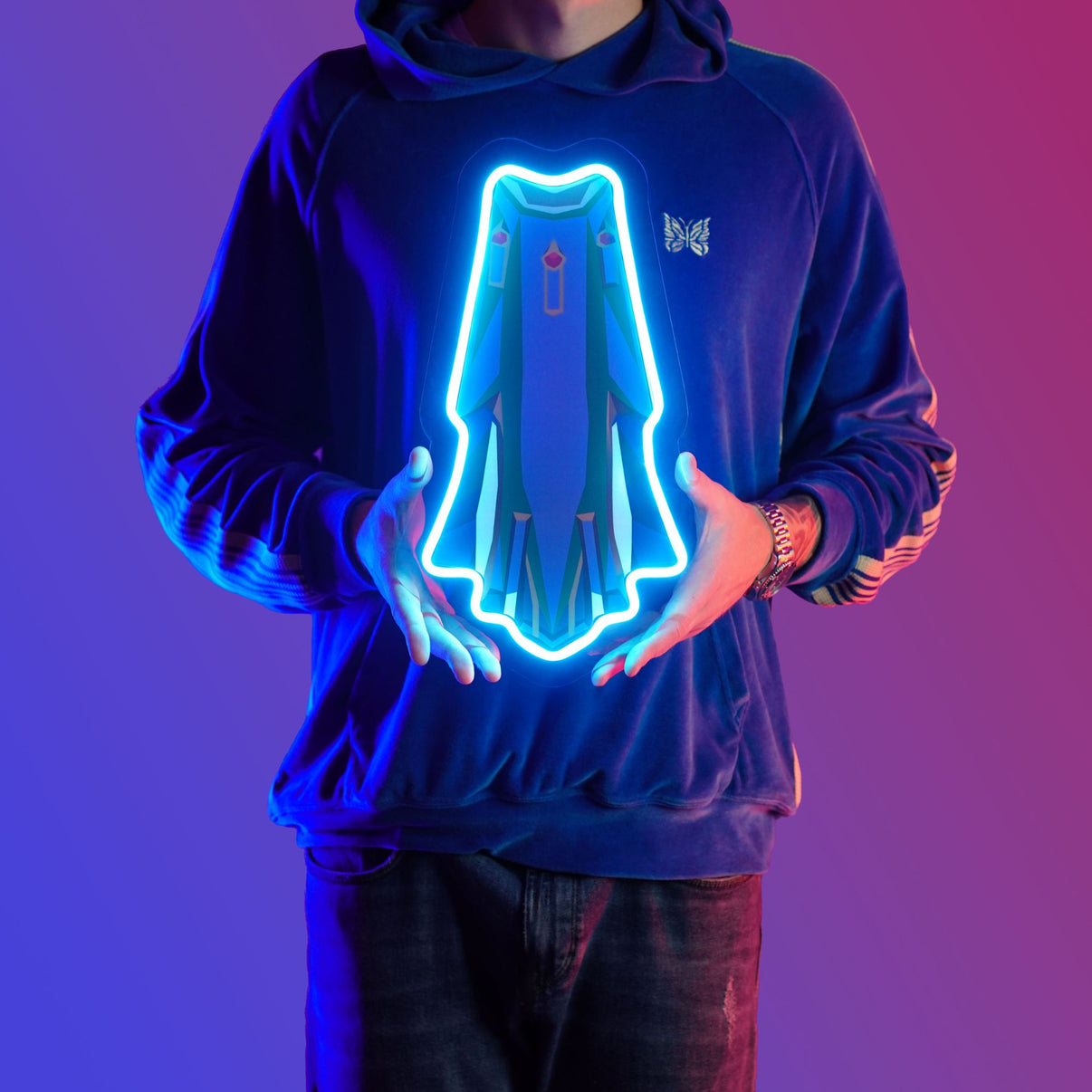 Man proudly holding Runescape Guthix max Cape LED neon sign