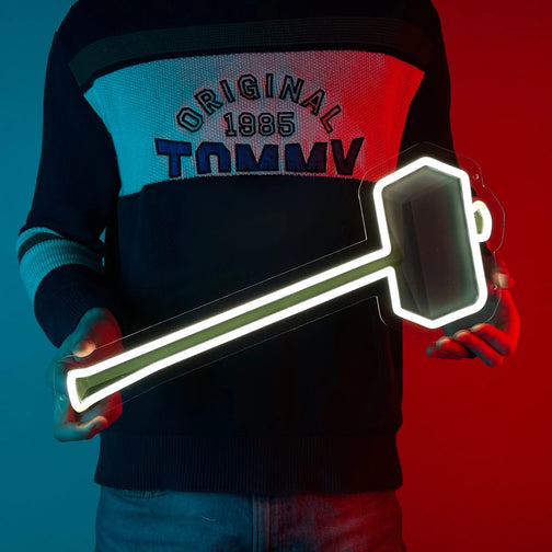 A man proudly holding a granite maul, a iconic weapon from Runescape, depicted on a LED neon sign.
