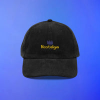 Black RuneScape corduroy hat with “nostalgia” text on the front, classic OSRS merch for long-time players.