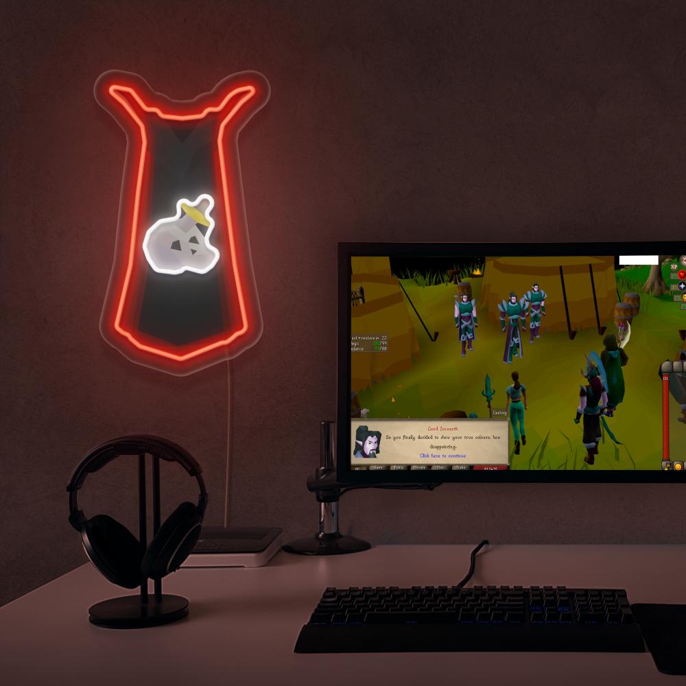 The Runescape Slayer Skillcape LED neon sign proudly sits next to a gaming PC, symbolizing the combat expertise and adventure of slayers in RuneScape. An emblem of courage and combat mastery, this LED neon sign adds a touch of excitement and thrill to any gaming space.