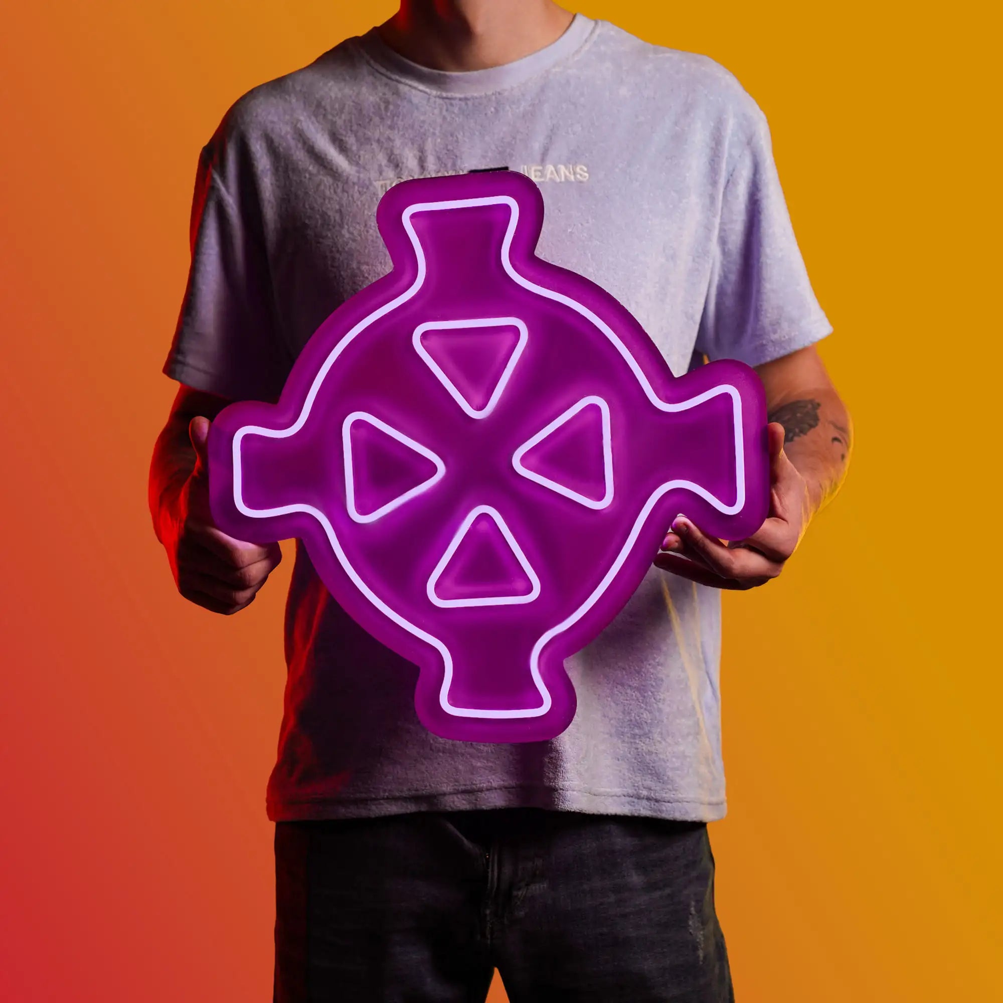 A person proudly displays the Runescape Zaros Symbol LED neon sign, featuring the iconic Zaros Symbol from the game. This LED neon sign symbolizes the power and influence of Zaros in RuneScape. A symbol of ancient magic and mystery, it adds a touch of intrigue to any gaming space.