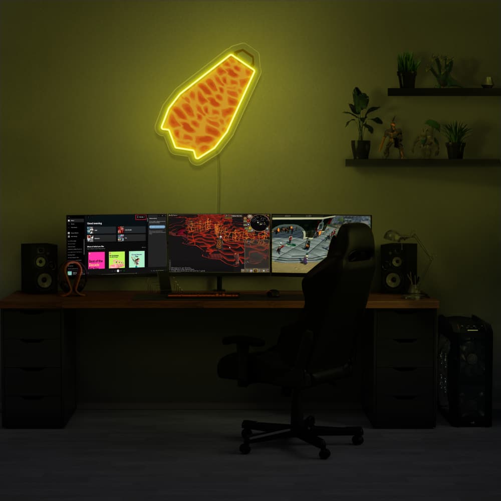 Illuminate your gaming setup with the Runescape Fire Cape LED neon sign mounted above a gaming PC. The iconic Fire Cape design adds a touch of glory and accomplishment to your gaming environment, reminiscent of conquering challenges in RuneScape. A unique gift for Runescape enthusiasts.