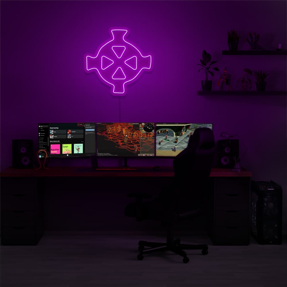 Illuminate your gaming setup with the Runescape Zaros Symbol LED neon sign mounted above a gaming PC. The Zaros Symbol represents the ancient magic and mystery of RuneScape. A perfect addition to the room, this LED neon sign enhances the ambiance for RuneScape enthusiasts.