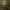 Osrs smithing cape neon sign shaped on a wall in a room with a bed and decorative items.