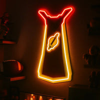 Old School Runescape Attack cape hanging on the wall in the room.