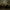Old School Runescape Fletching Neon sign above a gaming setup with multiple monitors and a chair in a dimly lit room.