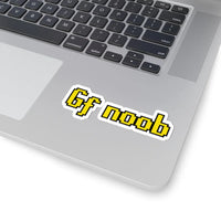 Gf noob OSRS sticker placed on laptop surface, Old School RuneScape chat phrase merch decal