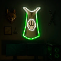 Runescape Hunter Cape hanging above gaming setup.