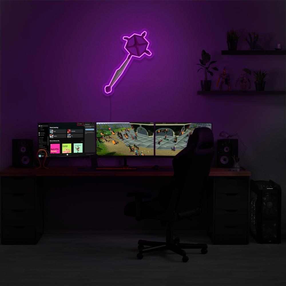 Illuminate your gaming setup with the OSRS Ancient Staff LED neon sign mounted above a gaming PC. This LED neon sign, featuring the iconic ancient staff from Old School RuneScape, adds an element of ancient wonder and enchantment to your gaming environment.