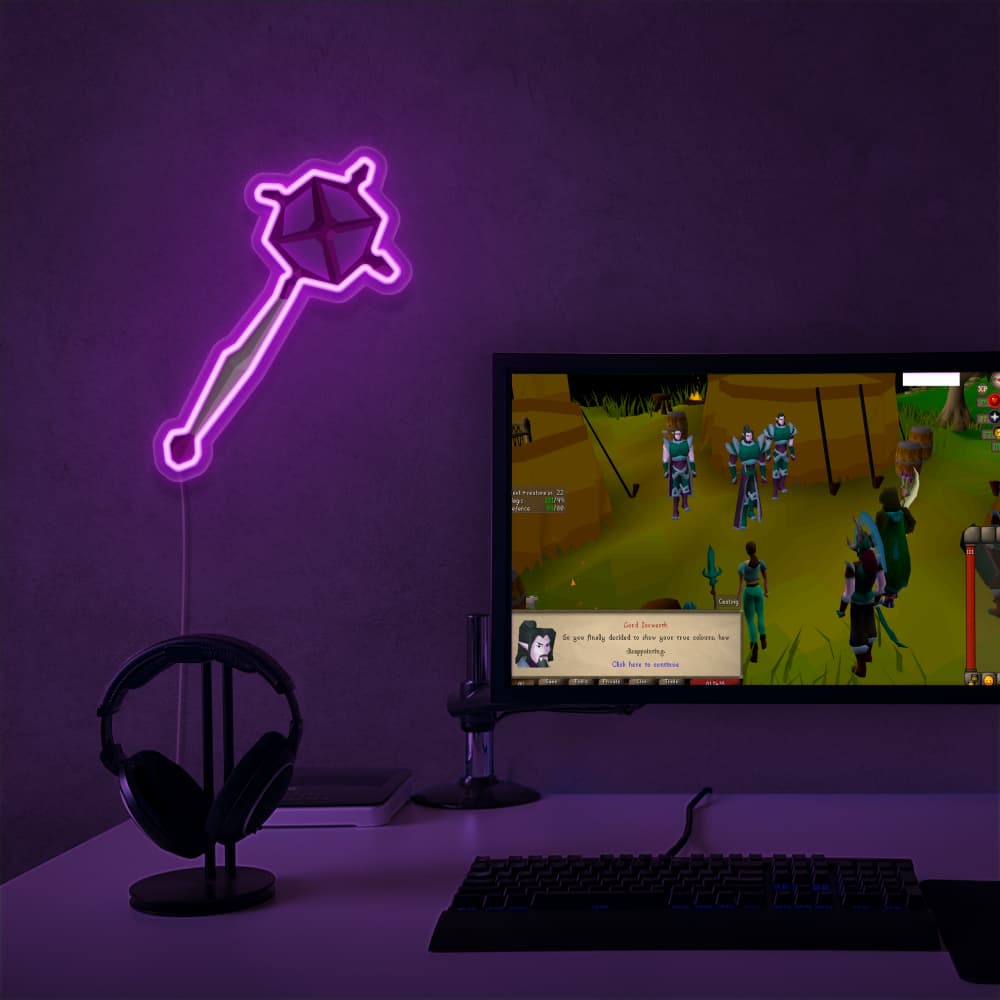 Elevate your gaming setup with the OSRS Ancient Staff LED neon sign placed next to a gaming PC. This LED neon sign, featuring the iconic ancient staff from Old School RuneScape, infuses your gaming space with ancient mysticism and inspiration.