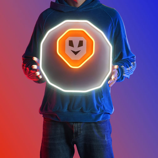 A person proudly displays the OSRS Chaos Rune LED neon sign, featuring the iconic Chaos Rune symbol from the game. This LED neon sign embodies the chaotic essence of Old School RuneScape, making it an ideal addition to any gaming space. A nostalgic and powerful gift for OSRS enthusiasts.