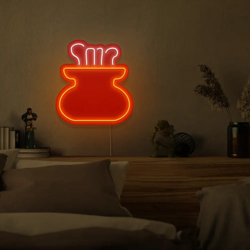 The OSRS Cooking LED neon sign is mounted above a bed, showcasing the cooking pot symbol from Old School RuneScape. This LED neon sign creates a cozy atmosphere in the bedroom, inviting players to reminisce about their culinary escapades in RuneScape.