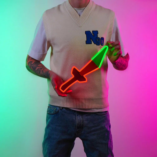 An individual proudly showcases the OSRS Dragon Dagger LED neon sign, featuring the iconic dagger symbol from the game. This LED neon sign exudes a sense of power and adventure, reflecting the thrill of wielding the Dragon Dagger in RuneScape.