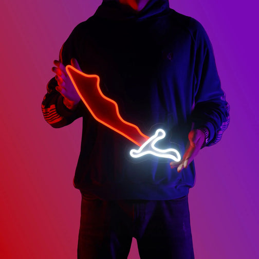 A person proudly displays the OSRS Dragon Scimitar LED neon sign, featuring the iconic scimitar symbol from the game. This LED neon sign captures the essence of adventure and combat in RuneScape. A perfect nostalgic gift for your RuneScape buddy.