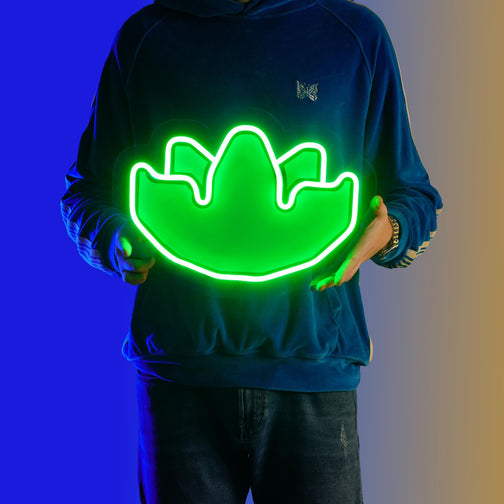A person proudly displays the OSRS Herblore LED neon sign, featuring the iconic Herblore symbol from the game. This LED neon sign celebrates the art of potion-making in Old School RuneScape, making it an ideal addition to any gaming space. A nostalgic and enchanting gift for OSRS enthusiasts.