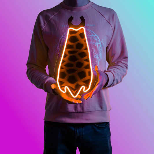 A person proudly displays the Old School Runescape Infernal Cape LED neon sign, featuring the iconic Infernal Cape from the game. This LED neon sign represents the pinnacle of achievement in Old School RuneScape. A prestigious and nostalgic gift for OSRS enthusiasts. 