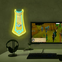 OSRS Inverted Fishing Master Cape LED neon sign mounted above gaming PC – RuneScape desk setup decor