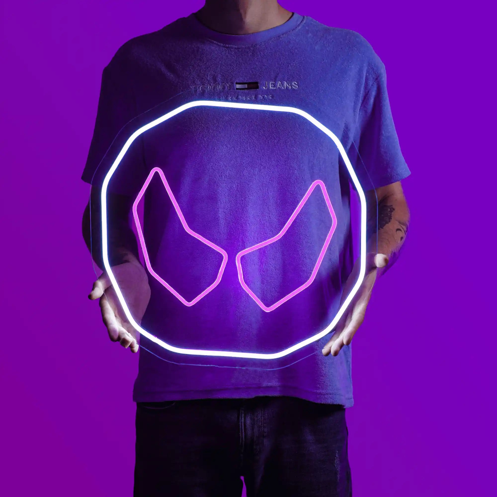 A person proudly displays the OSRS Soul Rune LED neon sign, featuring the iconic Soul Rune from the game. This LED neon sign symbolizes the mystical power and essence of souls in Old School RuneScape. A symbol of magic and mystique, it adds a touch of enchantment to any gaming space.