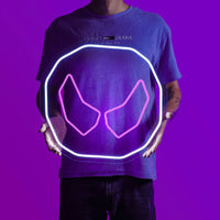 A person proudly displays the OSRS Soul Rune LED neon sign, featuring the iconic Soul Rune from the game. This LED neon sign symbolizes the mystical power and essence of souls in Old School RuneScape. A symbol of magic and mystique, it adds a touch of enchantment to any gaming space.