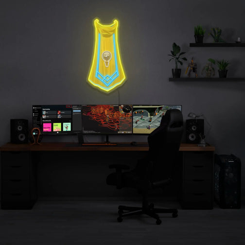 RS3 Invention Cape LED neon sign mounted above a gaming PC. Illuminate your gaming setup with this LED neon sign, featuring the Invention cape from RS3, ideal for RuneScape fans aiming to create an immersive gaming environment.