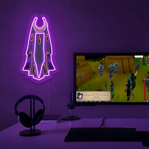 Elevate your gaming setup with the Runescape Ardougne Max Cape LED neon sign placed next to a gaming PC. This LED neon sign, featuring the prestigious Ardougne Max Cape, serves as a constant reminder of your gaming achievements.