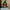 Unboxed Runescape Clan logo neon sign standing on the floor.