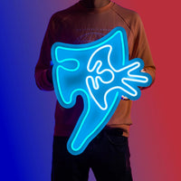 A person proudly showcases the Runescape Elysian Spirit Shield LED neon sign, featuring the iconic Elysian shield design from the game. This LED neon sign exudes power and protection, making it an ideal addition to any gaming space. A nostalgic gift for Runescape fans.
