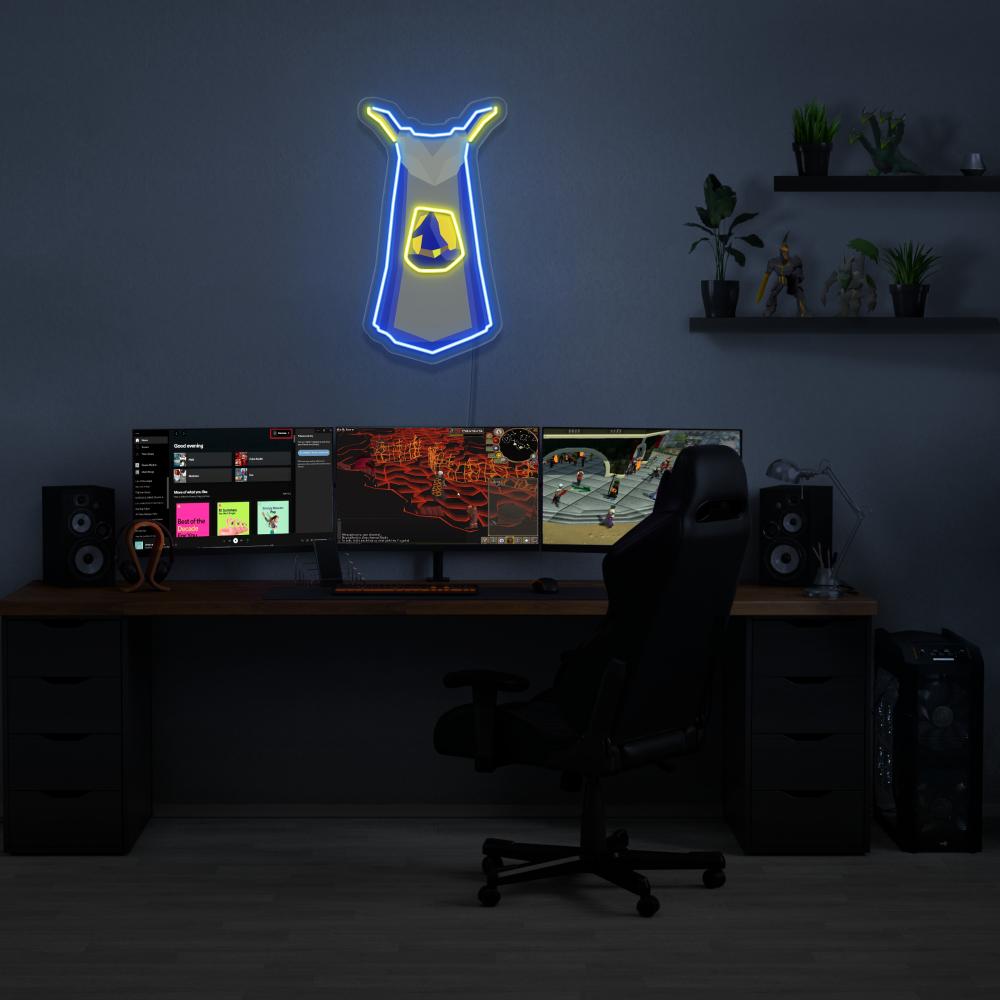 Illuminate your gaming setup with the Runescape Magic Skillcape LED neon sign mounted above a gaming PC. The iconic Magic Skillcape symbolizes mastery and expertise in the arcane arts of Old School RuneScape. A perfect addition to the room, this LED neon sign enhances the ambiance for RS enthusiasts.
