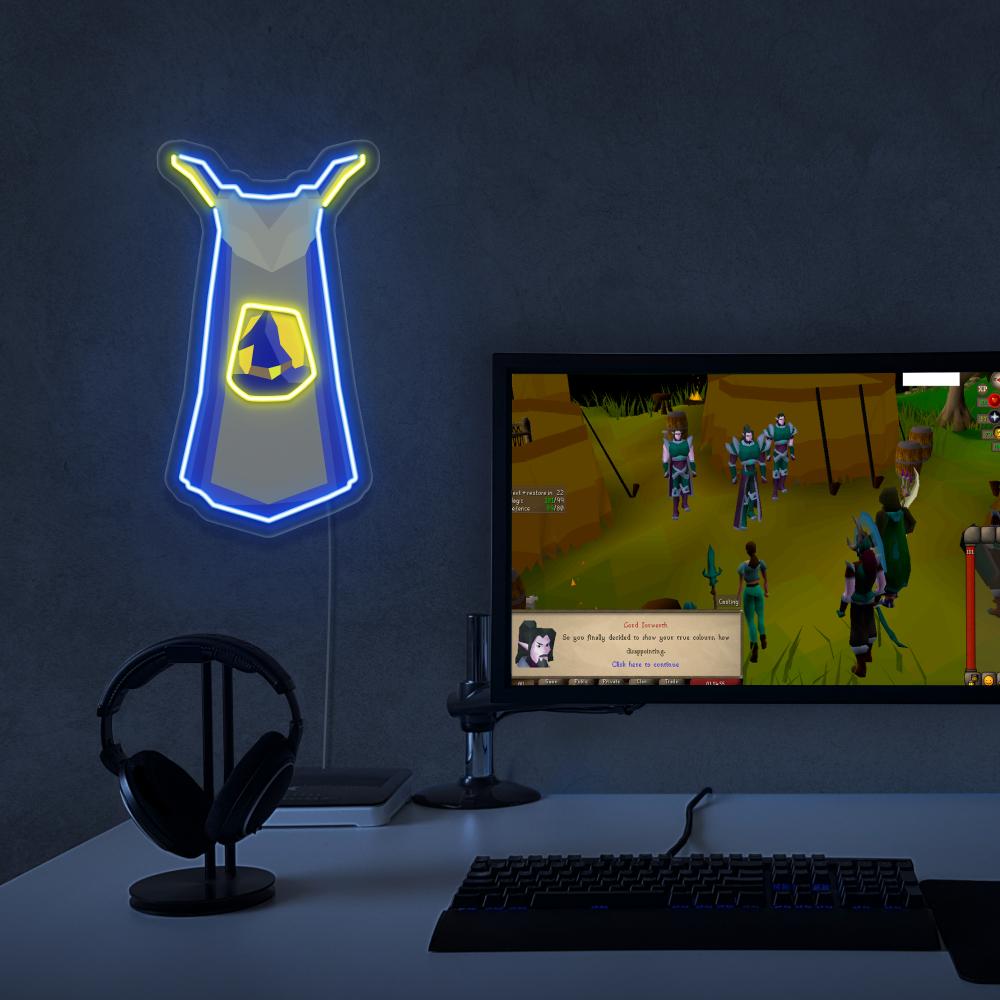 The Runescape Magic Skillcape LED neon sign proudly sits next to a gaming PC, symbolizing the mastery and expertise of magic wielders in Old School RuneScape. An emblem of achievement and skill, this LED neon sign adds a touch of magic and prestige to any gaming space.