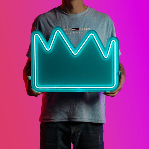 A person proudly displays the Runescape Partyhat LED neon sign, featuring the iconic Partyhat from the game. This LED neon sign represents wealth and celebration in Old School RuneScape. A symbol of extravagance and rarity, it adds a touch of luxury to any gaming space.