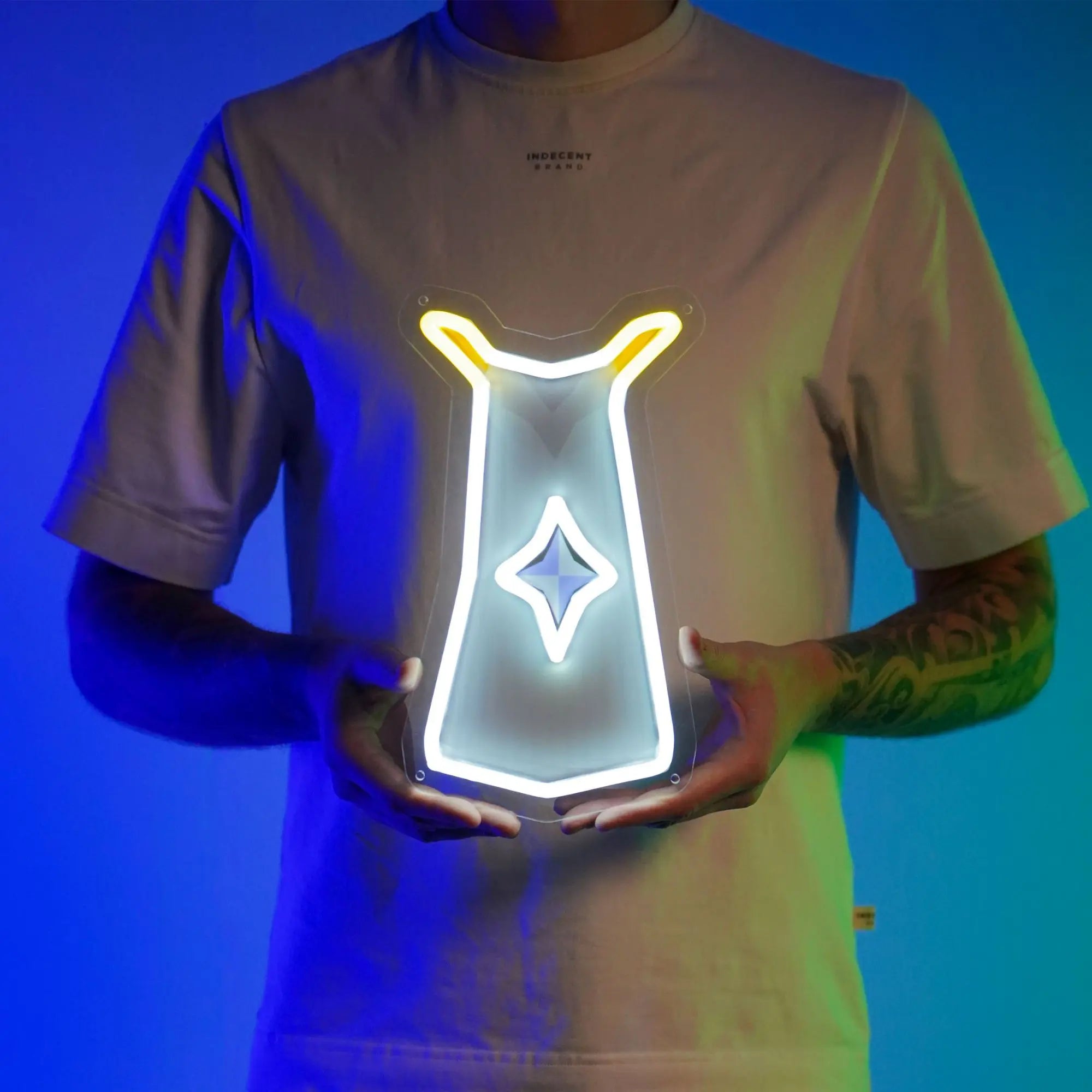 A person proudly displays the Runescape Prayer Skillcape LED neon sign, featuring the iconic Prayer Skillcape from the game. This LED neon sign represents devotion and spirituality in Old School RuneScape. A symbol of faith and reverence, it adds a touch of solemnity to any gaming space.