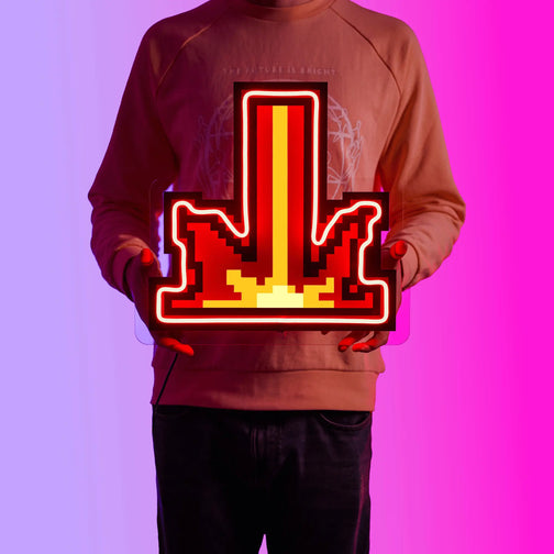 A person proudly displays the Runescape Retribution LED neon sign, featuring the iconic Retribution spell icon from the game. This LED neon sign symbolizes the power and justice of retribution in Old School RuneScape. A symbol of vengeance and righteousness, it adds a touch of authority to any gaming space.