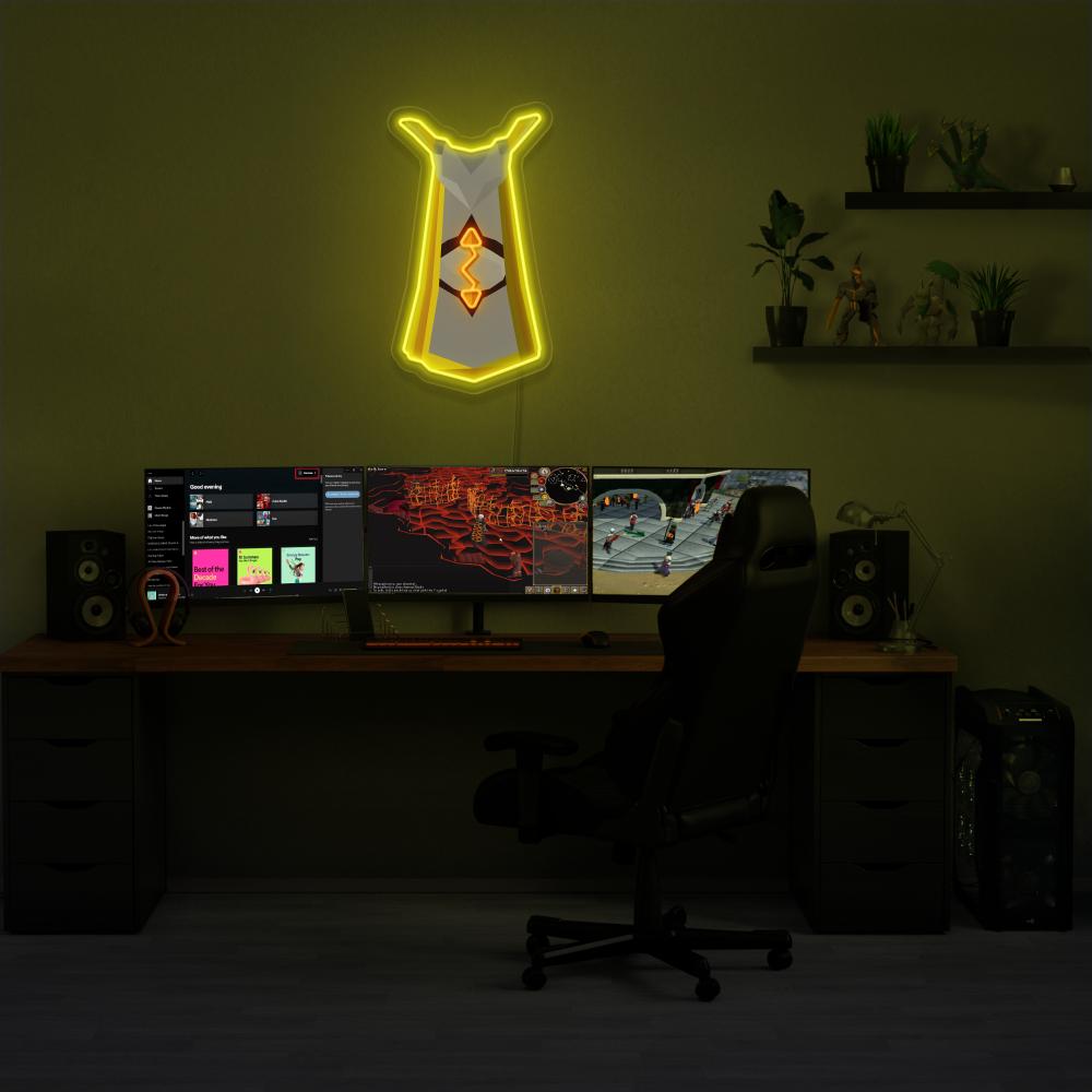 Illuminate your gaming setup with the Runescape Runecrafting Skillcape LED neon sign mounted above a gaming PC. The Runecrafting skillcape symbolizes the mastery and creativity of runecrafters in RuneScape. A perfect addition to the room, this LED neon sign enhances the ambiance for RuneScape enthusiasts. 