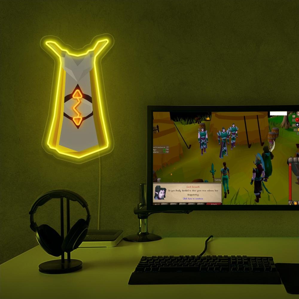 The Runescape Runecrafting Skillcape LED neon sign proudly sits next to a gaming PC, symbolizing the expertise and dedication of runecrafters in RuneScape. An emblem of magic and creativity, this LED neon sign adds a touch of enchantment and mystique to any gaming space.