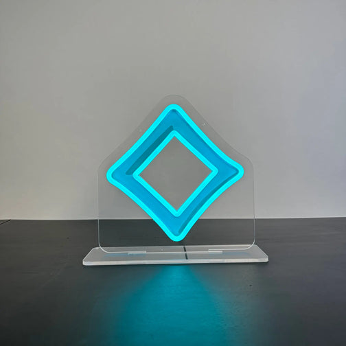 A Seren God Symbol LED neon sign standing on a table, emitting a vibrant glow with lights on, perfect for Runescape fans.
