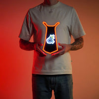 A person proudly displays the Runescape Slayer Skillcape LED neon sign, featuring the iconic Slayer skillcape from the game. This LED neon sign symbolizes the expertise and prowess of slayers in RuneScape. A symbol of adventure and combat mastery, it adds a touch of excitement to any gaming space.