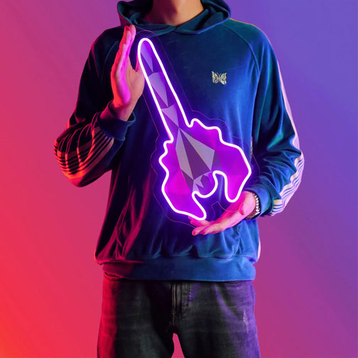 A person proudly displays the Runescape Toxic Blowpipe LED neon sign, featuring the iconic Toxic Blowpipe weapon from the game. This LED neon sign symbolizes the deadly venom and precision of the Toxic Blowpipe in RuneScape. A symbol of ranged combat prowess and lethality, it adds a touch of danger to any gaming space.