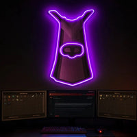 Thieving cape neon sign hanging above gaming setup.