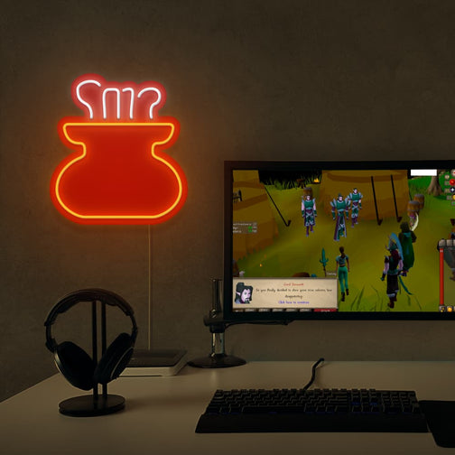 The OSRS Cooking LED neon sign is positioned next to a gaming PC, featuring the cooking pot symbol from Old School RuneScape. This LED neon sign adds a nostalgic flair to your gaming setup, reminding players of their culinary adventures in RuneScape.