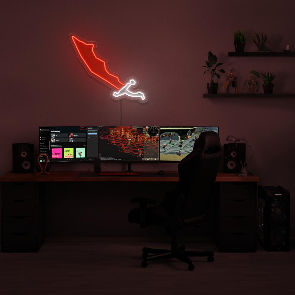 Brighten up your gaming setup with the OSRS Dragon Scimitar LED neon sign mounted above a gaming PC. The iconic scimitar symbol from the game adds a touch of nostalgia to your gaming environment, evoking memories of your adventures in RuneScape. A unique gift for your RuneScape buddy.