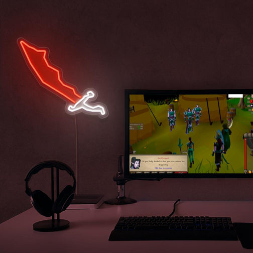Elevate your gaming space with the OSRS Dragon Scimitar LED neon sign positioned near a gaming PC. Featuring the iconic scimitar symbol from the game, this LED neon sign brings back memories of epic battles and quests in RuneScape. An ideal gift for your RuneScape buddy. 