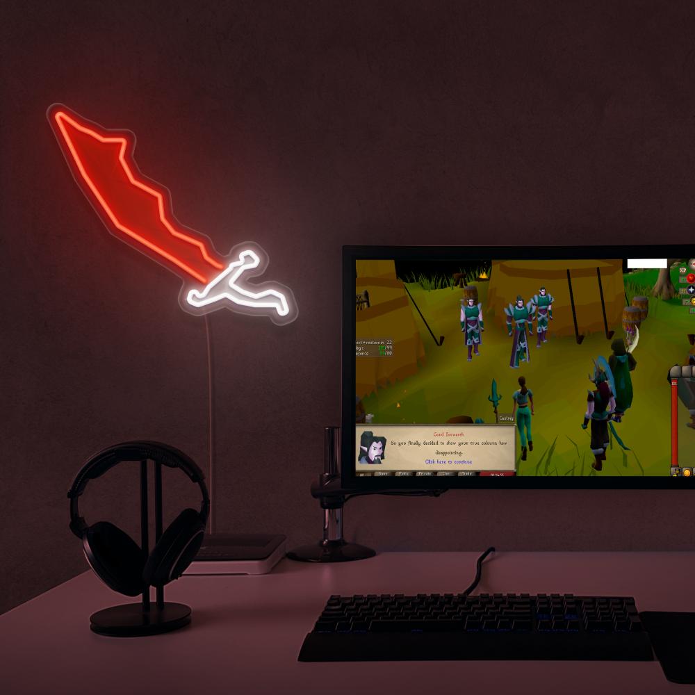 RuneScape Dragon Scimitar LED neon sign next to gaming PC – OSRS setup wall decor