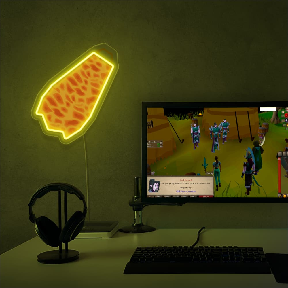 RuneScape Fire Cape LED neon sign next to gaming PC – OSRS setup wall decor