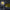 RuneScape Happy Chaos Rune LED neon sign in gaming setup with monitors – OSRS room decor